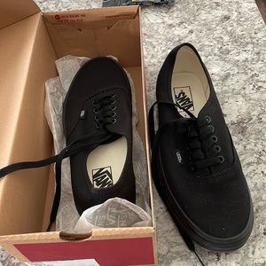 Black Vans. Never worn. Size 9.5 Men’s and 11 Women’s.